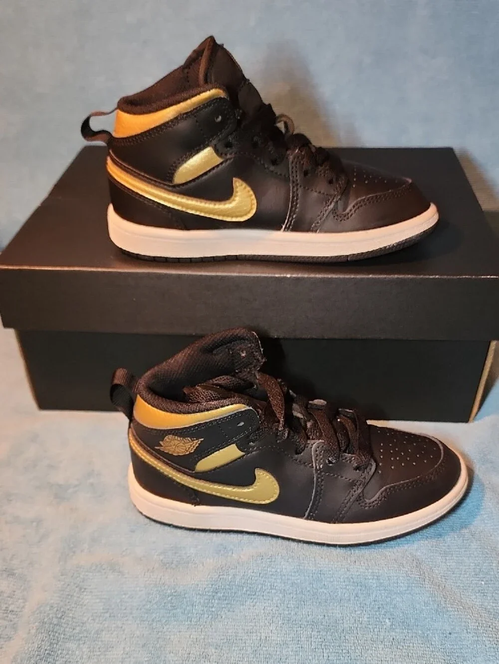 Jordan Black and Metallic Gold Mid-Top Sneakers